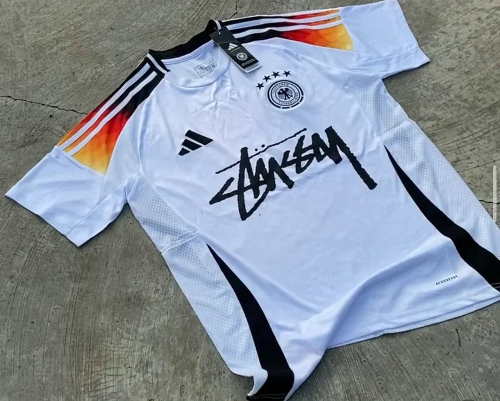 STUSSY X “GERMANY” JERSEY - WHITE